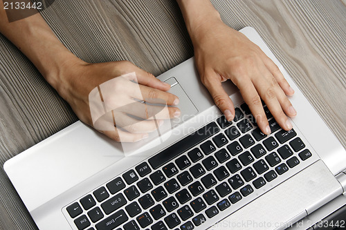 Image of Young woman with laptop 