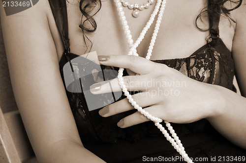 Image of Woman with pearl necklace