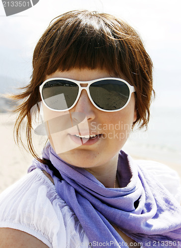 Image of Young woman on the beach