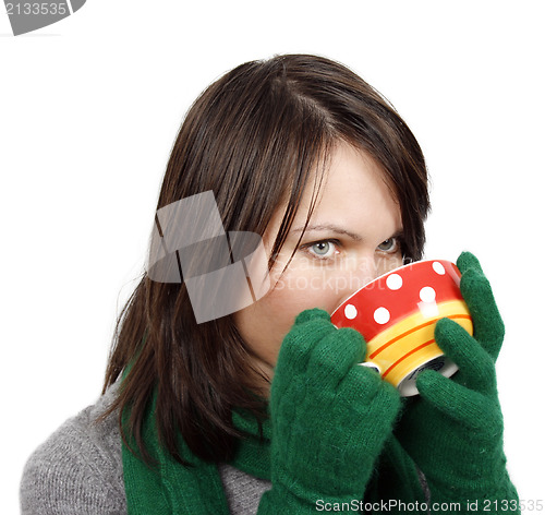 Image of Woman drinking a hot beverage