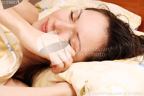 Image of Young woman awaking