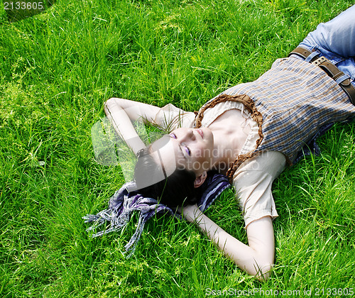 Image of Female lying on the grass 