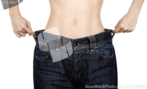 Image of Slim woman in big jeans