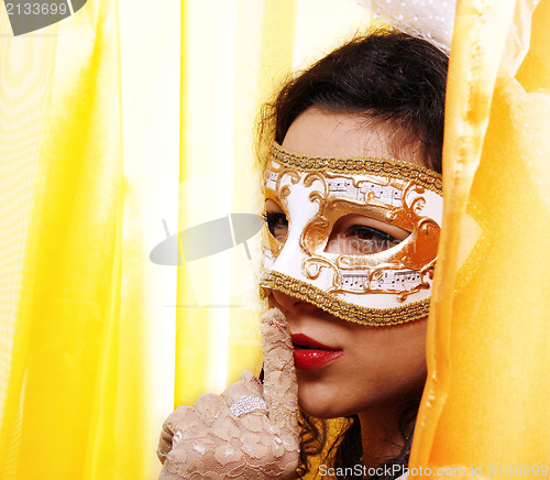 Image of Woman wearing a carnival mask 