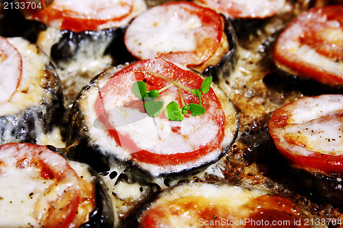 Image of Backed eggplant, mozzarella, tomatoes and basil