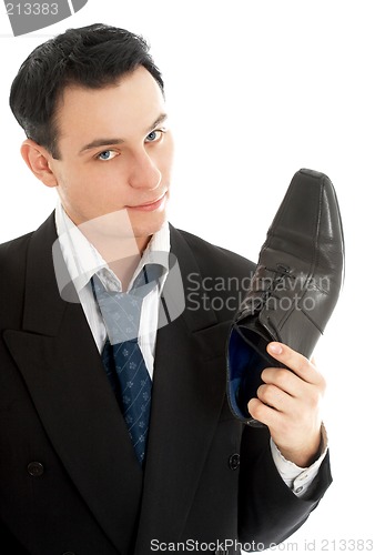 Image of salesman with black leather boot