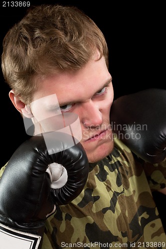 Image of young man in boxing gloves