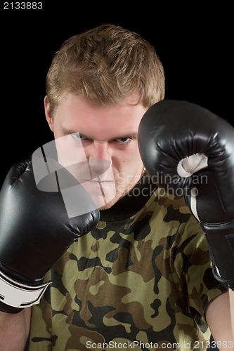 Image of young man in boxing gloves