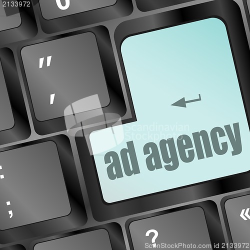 Image of Advertising concept: computer keyboard with word Ad Agency, selected focus on enter button