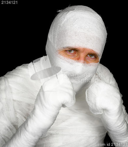 Image of Completely bandaged man is ready to fight