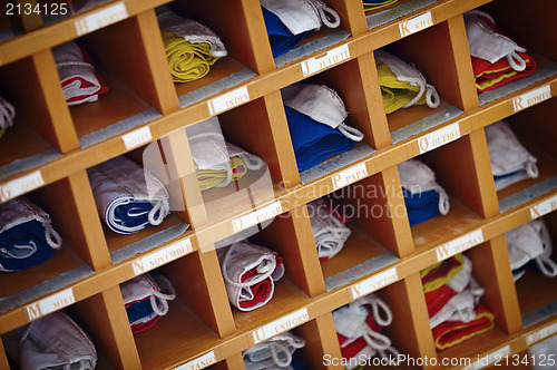 Image of Marine sea signal flags in wooden cupboard