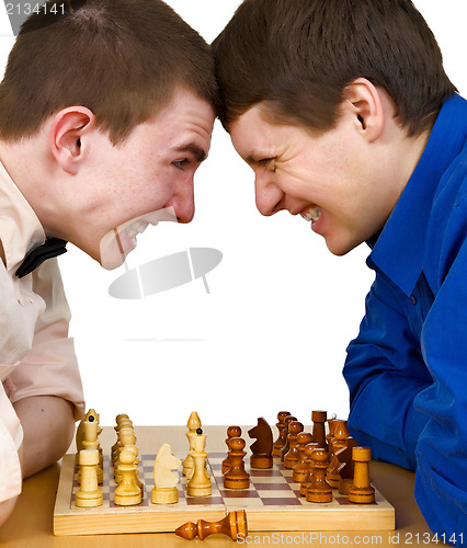 Image of Two aggressive chess opponents under chess board