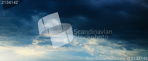 Image of Panorama - sunbeams in stormy dark cloudy sky