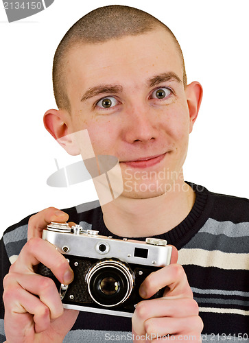 Image of Satisfied young man with vintage photo camera