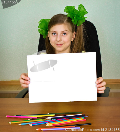 Image of Schoolgirl artist with white blank paper sheet