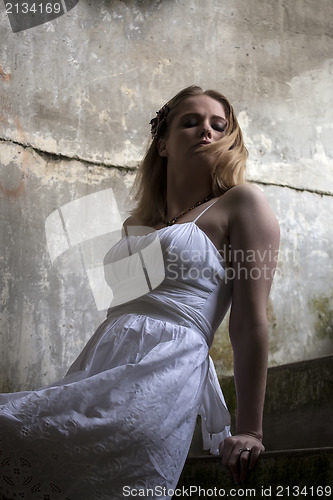 Image of Beautiful Young Blonde Woman with White Dress