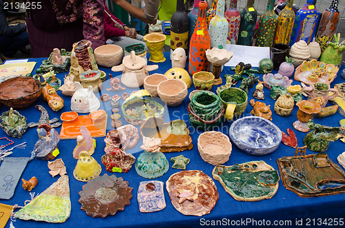 Image of clay crockery kid craft wares outdoor fair 