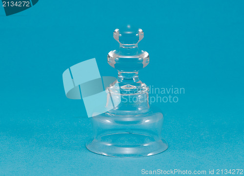 Image of beautiful curvy glass decoration blue background 