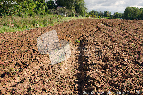 Image of tractor mark trail soil plow field house farm 