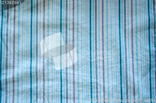 Image of crumple fabric blue grey lines white background 