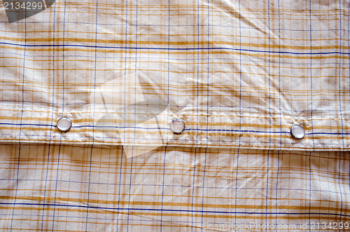 Image of shirt fabric lines glossy glass buttons background 