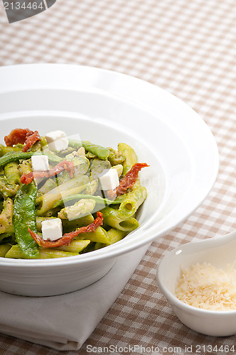 Image of Italian penne pasta with sundried tomato and basil