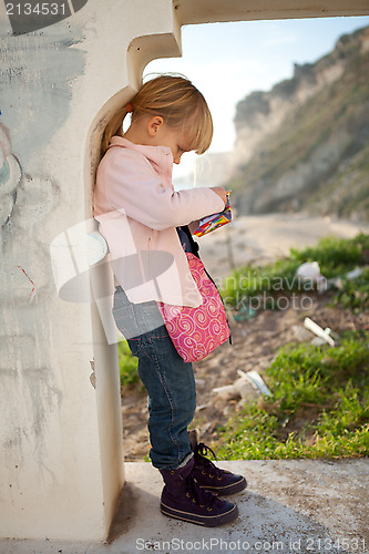 Image of Young girl in archway