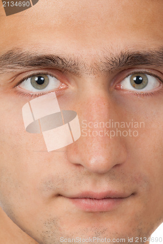 Image of Young man's face. Close up macro portrait