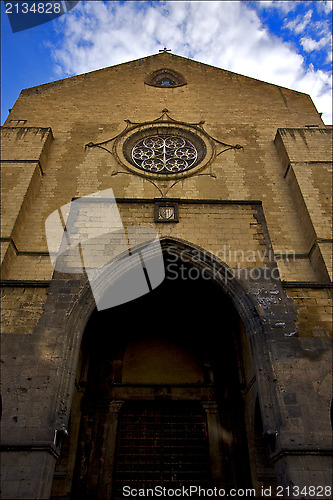 Image of door and a cross in old church