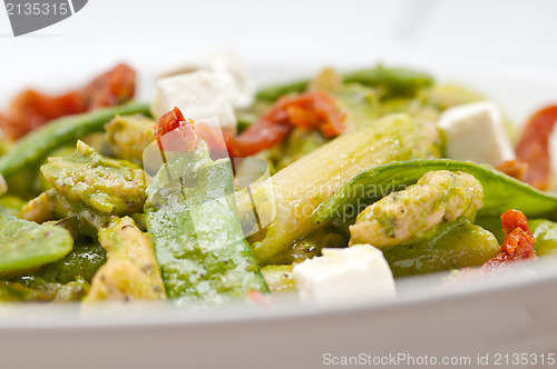 Image of Italian penne pasta with sundried tomato and basil
