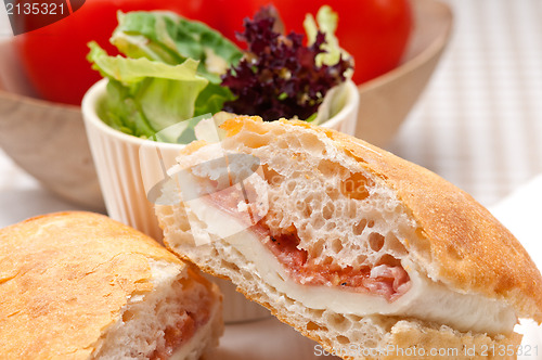 Image of ciabatta panini sandwich with parma ham and tomato