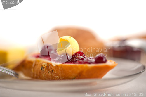 Image of bread butter and jam 