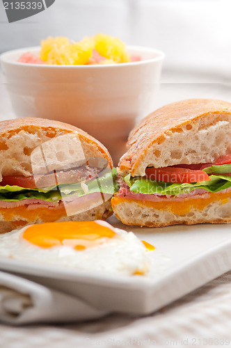 Image of ciabatta panini sandwich eggs tomato lettuce