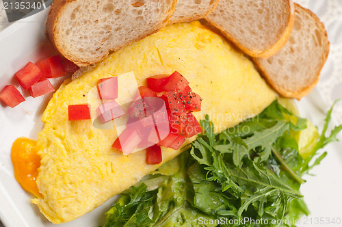 Image of cheese ometette with tomato and salad