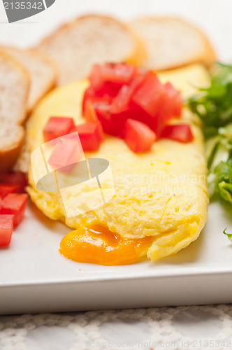 Image of cheese ometette with tomato and salad