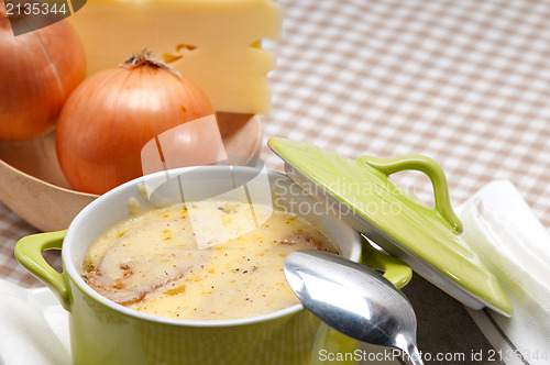 Image of oinion soup with melted cheese and bread on top