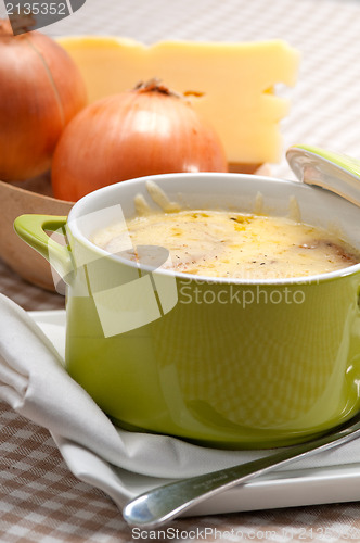 Image of oinion soup with melted cheese and bread on top