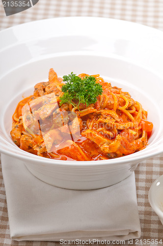 Image of Italian spaghetti pasta with tomato and chicken