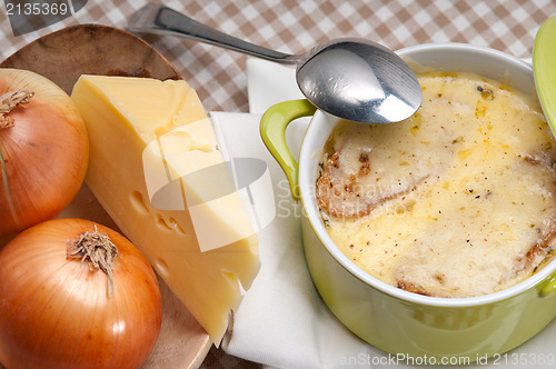 Image of oinion soup with melted cheese and bread on top