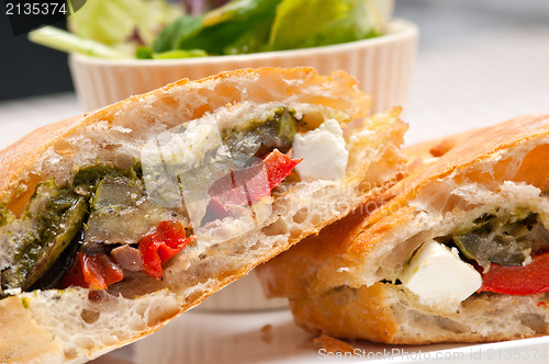 Image of ciabatta panini sandwichwith vegetable and feta