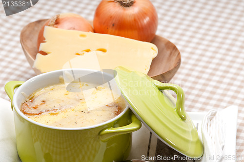 Image of oinion soup with melted cheese and bread on top