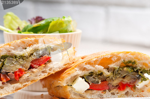 Image of ciabatta panini sandwichwith vegetable and feta