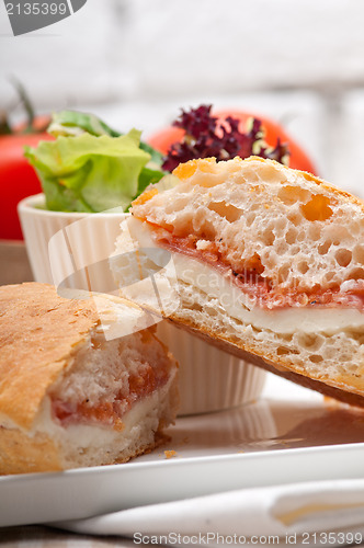 Image of ciabatta panini sandwich with parma ham and tomato