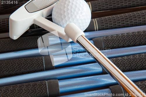 Image of Golf putter and golf clubs