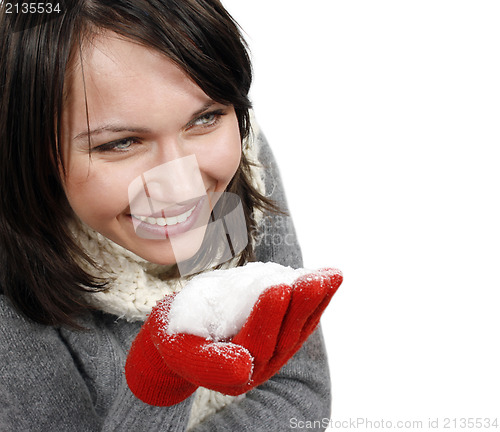 Image of Woman blowing snow