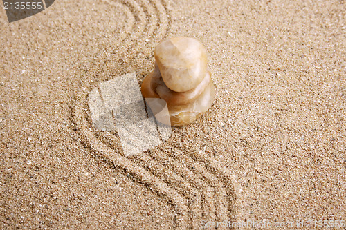 Image of Zen stone in the sand 