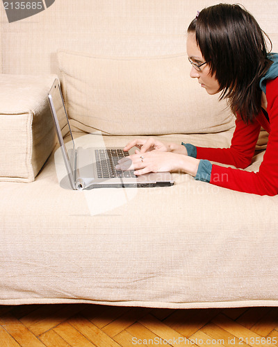 Image of Young girl on the sofa