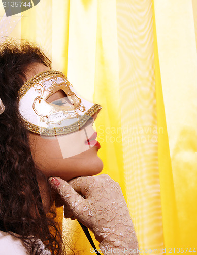 Image of Woman wearing a carnival mask 