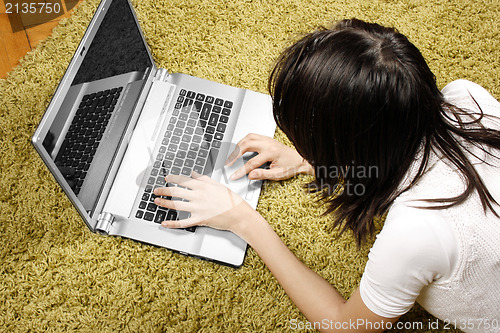 Image of Young woman with laptop 