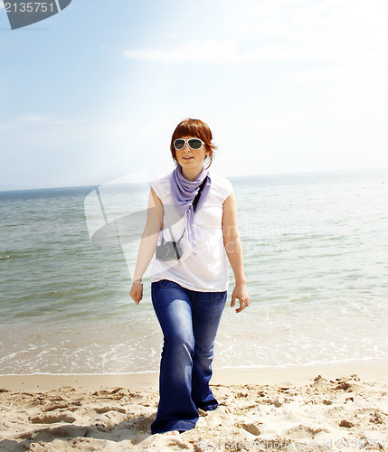 Image of Young woman on the beach